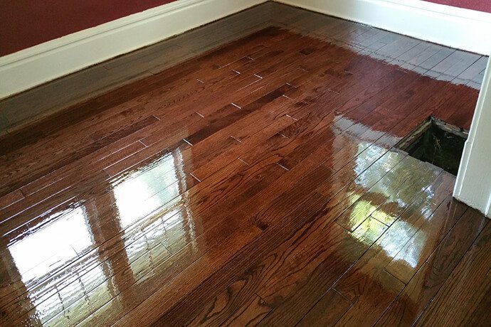 a resurfaced hardwood floor in a forest acres bedroom